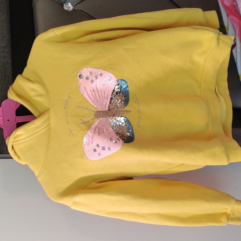 Yellow girls hoodie with butterfly sequin detail. Size 6x/7
